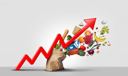 Rising food cost and grocery prices surging costs of supermarket groceries as an inflation financial crisis concept coming out of a paper bag shaped hit by a a finance graph arrow with 3D render elements.